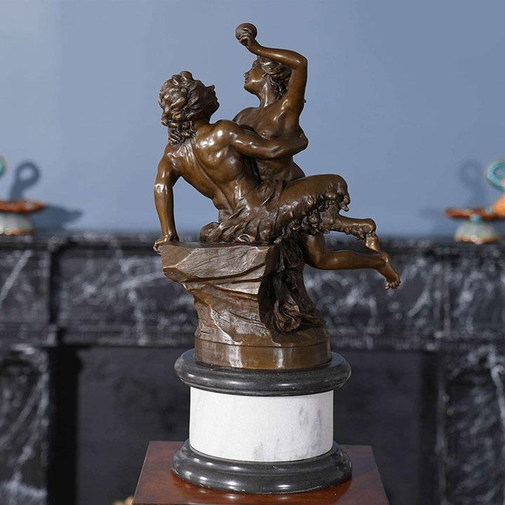 nymph and satyr statue