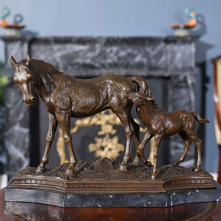 bronze sculpture of mare and foal