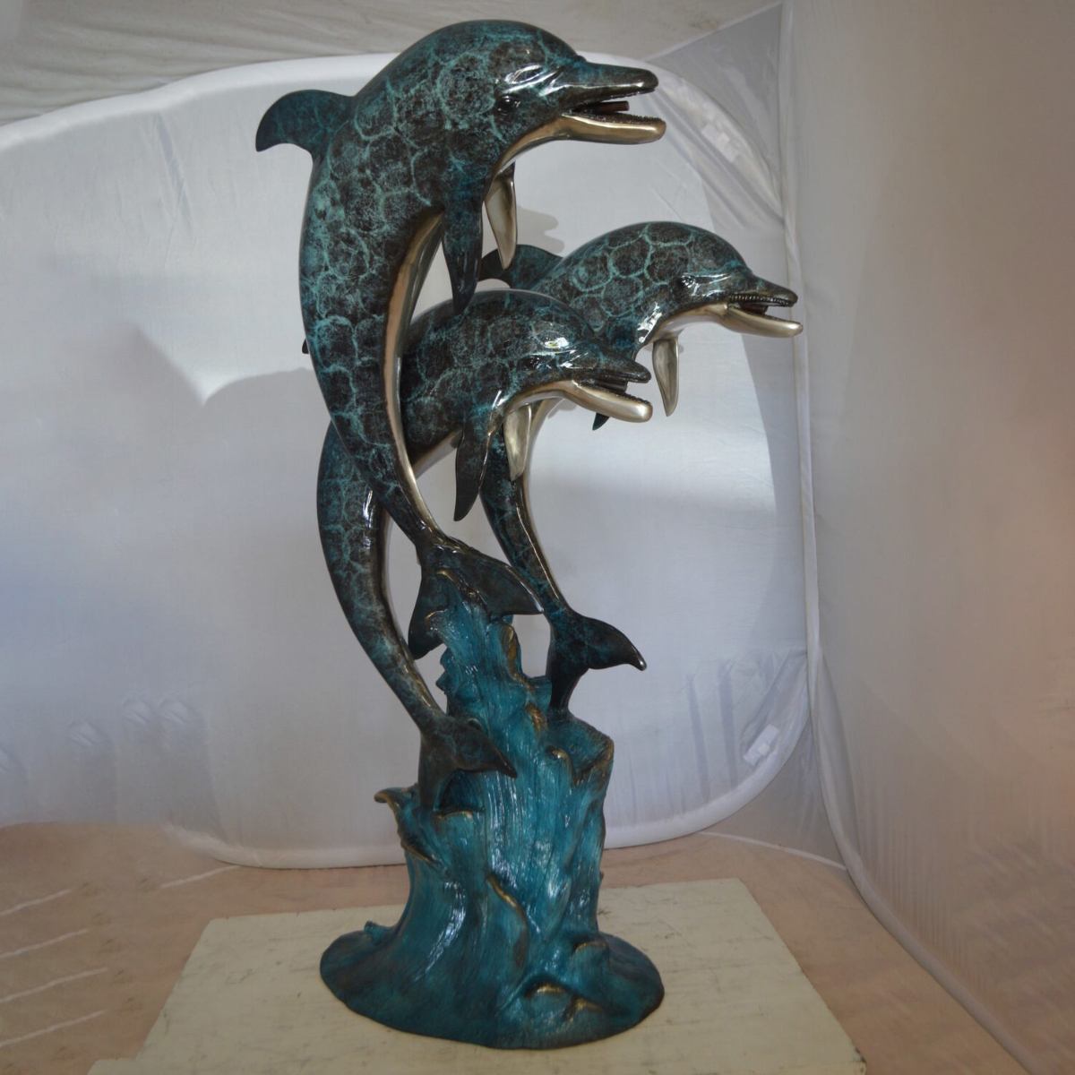 copper dolphin statue