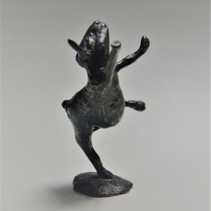 dancing goat figurine