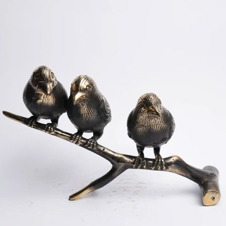 birds on a branch statue