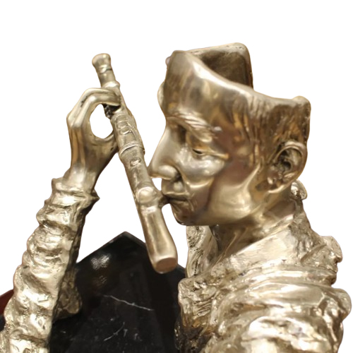 flute player statue