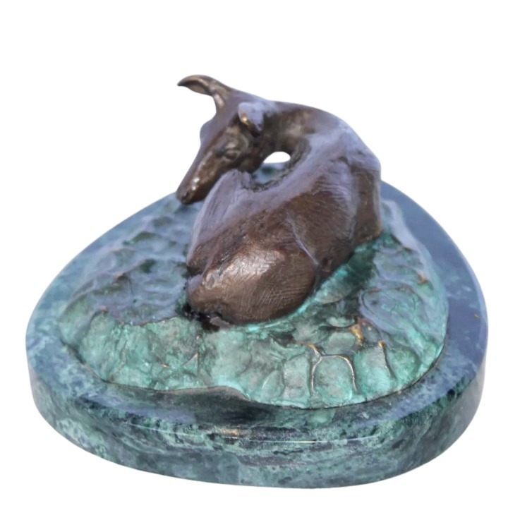 laying down deer statue